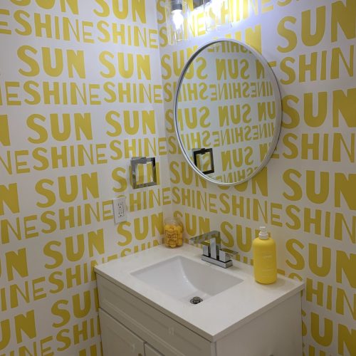 clean sink and mirror in colorful bathroom