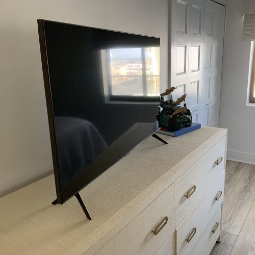 clean bedroom flatscreen tv